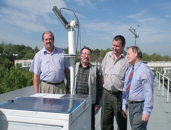An image of the site manager Alexander Aculinin and Atmospheric Research Group colleagues Vladimir Smicov, Albert Policarpov and Vitali Graciov with the sun photometer.