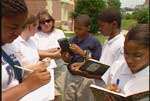 Students using a hazemeter to measure aerosols