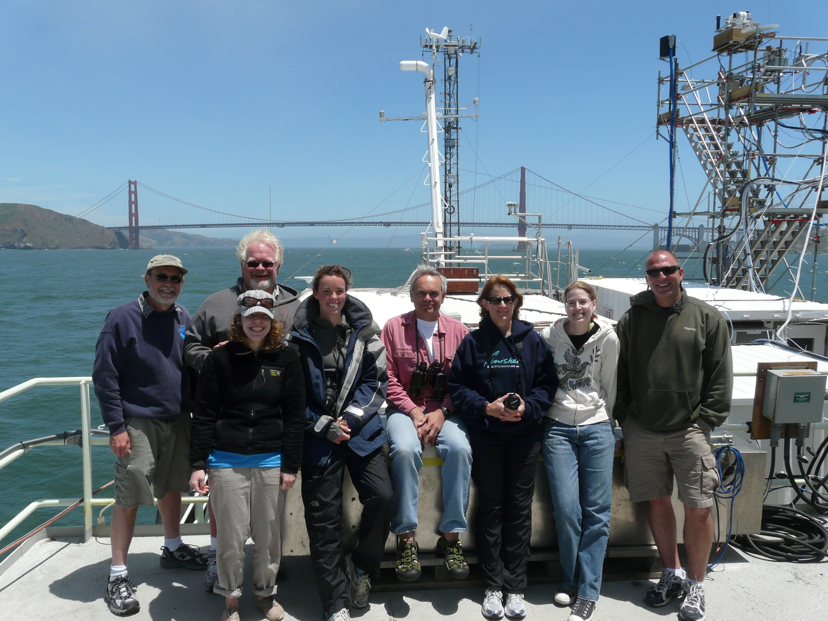 Onboard the R/V Atlantis: Chief Scientist Dr. Timothy Bates (fourth from the right), Dr. Patricia Quinn (third from the right), and Mr. Drew Hamilton (second from the left)