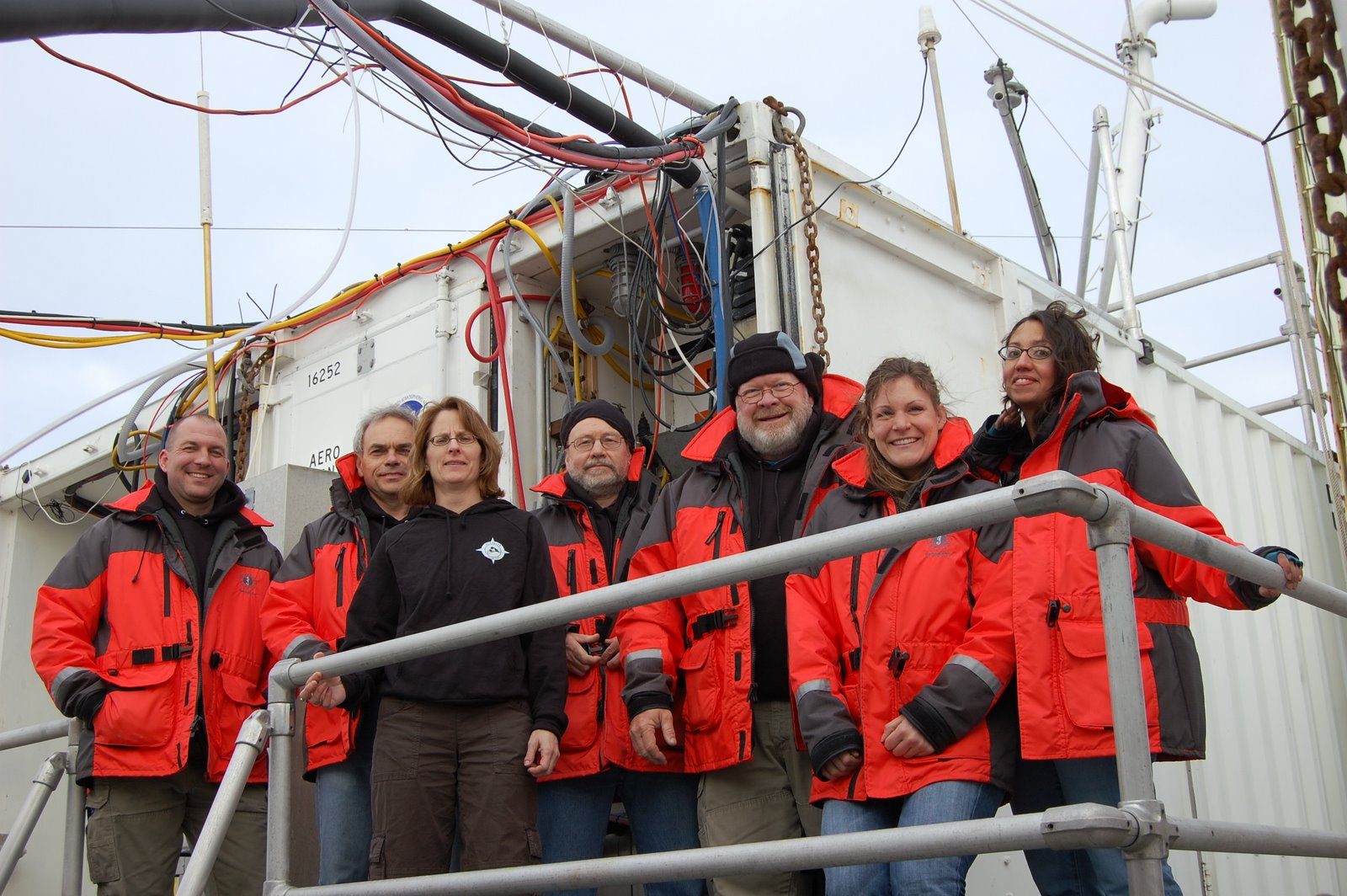 Onboard the R/V Knorr: Chief Scientist Dr. Timothy Bates (second from the left), Dr. Patricia Quinn (third from the left), and Mr. Drew Hamilton (third from the right)