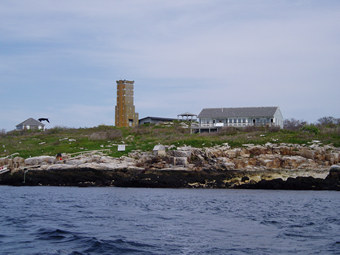 View of Appledore Island.  The UNH observatory and Sun Photometer are located in the 60 foot tall concrete tower centered in the picture.