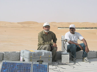 Cimel sunphotometer at Hamim site with engineers Mohammed Ramzan (left) and Ashraf (right) pictured.