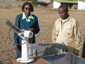 View of the sunphotometer with site manager Christine Mwinzi.