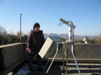 Zhang Wenxing with the sun photometer in Xinglong,China.