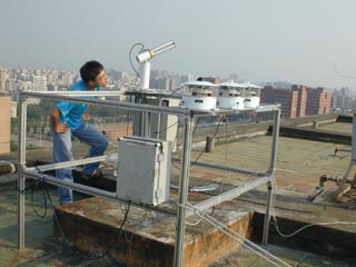 A view of the operator checking the Cimel solar tracking. 