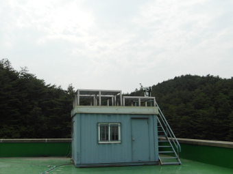 A view of the observation platform on top of a container box which houses computers.