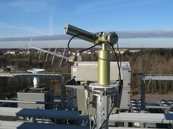 Cimel pointing to the sun. The satellite transmitter antenna is on the back.