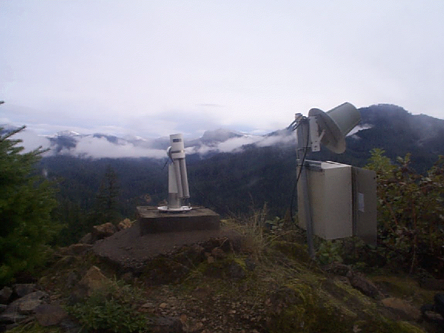 A view from the site and a view of the sun photometer and satellite transmitter