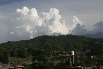 Facing Southeast towards CIMEL, frequent afternoon convection induced by local topography can be observed.  Often conditions are similar in all directions of the site (not shown) depending on the prevailing flow during the premonsoon season.