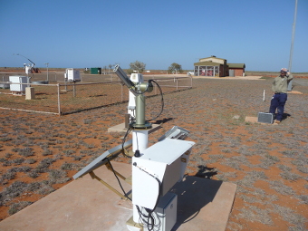 The AeroSpan/AERONET cimel sun photometer set up at Learmonth, Western Australia. The buildings in the background other instruments are associated with the Australian Bureau of Meteorology.