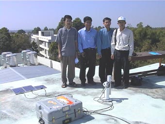 A view of the site managers with the sunphotometer.