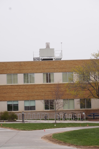 A view of the south west corner of the George Romney building on the Brigham Young University  Idaho Campus in Rexburg Idaho.   The platform seen on the building roof will support the AERONET sensor. The sensor will be mounted to the North side of the platform (left side). 
