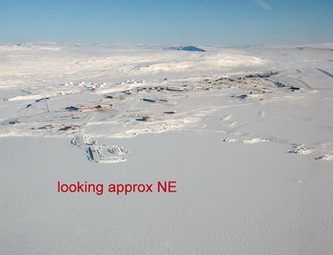 Thule Air Base seen from approaching helicopter. Main Base area and North Mountain can be seen. South Mountain is not visible to the right.