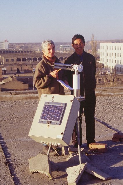 Zhang Jiping and Bernadette Chatenet on the roof with the sun photometer in Yulin, China.